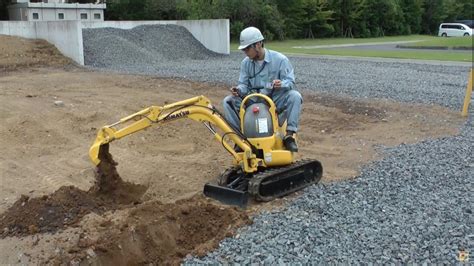 how to work a mini excavator|mini excavator digging.